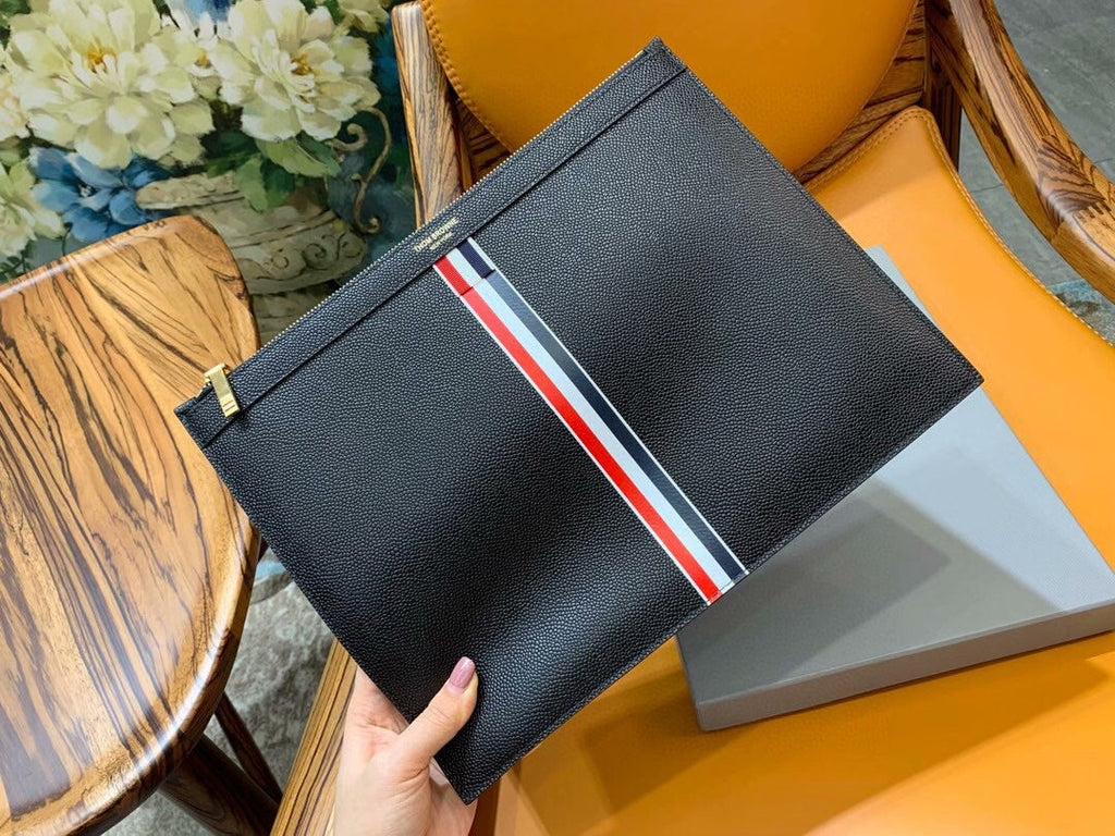 Three-color woven clutch bag
