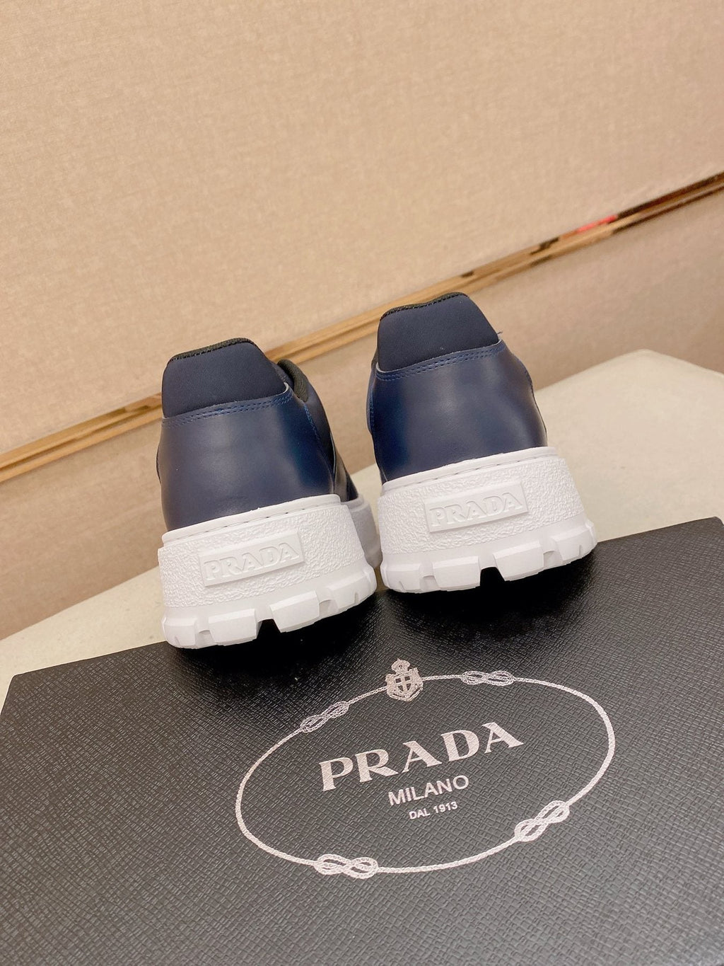 Prada Triangle Plaque Low-Top Sneakers - Treaded Rubber Sole